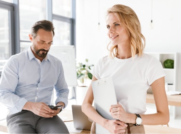 confident-man-manager-using-mobile-phone-PKUB4RV@2x